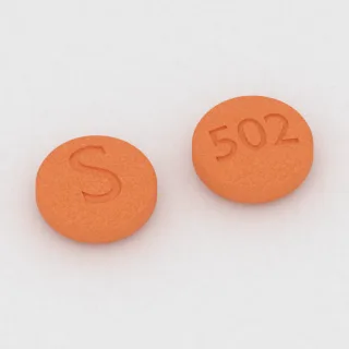 Amantadine 100 mg tablet: orange, round, 7 mm, imprinted S on one side and 502 on the other.