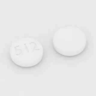 Chlorpromazine 100 mg tablet: white, round, 9 mm, imprinted 512.