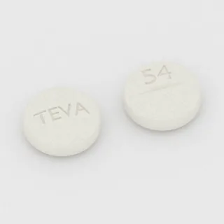 Buspirone 10 mg tablet: white, round, 8 mm, scored, imprinted TEVA on one side and 54 on the other.