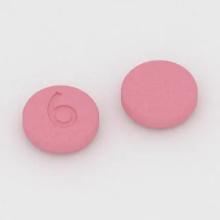 Amantadine 100 mg tablet: pink, round, 7 mm, imprinted 6.