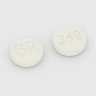 Tablet Bupropion 348 mg: putih, bulat, 9 mm, dengan kode cetak BR di satu sisi dan 348 di sisi lainnya.