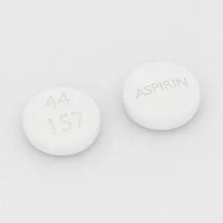 Aspirin 325 mg tablet: white, round, 10 mm, imprinted 44 157 ASPIRIN.