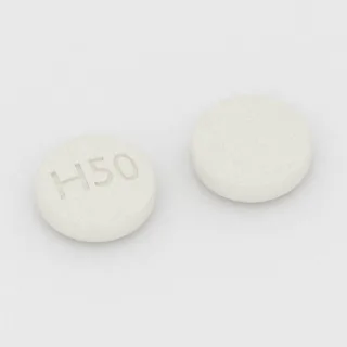 Acarbose 50 mg tablet: white, round, 7 mm, imprinted H50.