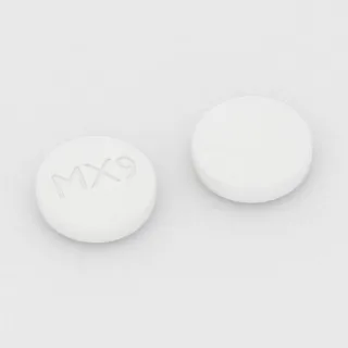 बुडेसोनाइड 9 mg टैबलेट: सफ़ेद, गोल, 10 mm, इम्प्रिंट MX9।