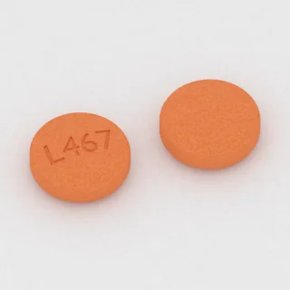 Aspirin 81 mg tablet: turuncu, yuvarlak, 8 mm, üzerinde L467 baskısı var.
