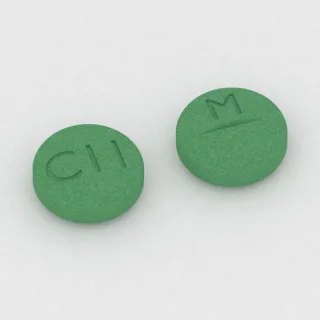 Klozapina 100 mg, tabletka: zielona, okrągła, 9 mm, z linią podziału, z oznaczeniem C11 po jednej stronie i M po drugiej.