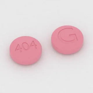 Atowakwon + proguanil 250 mg / 100 mg, tabletka: różowa, okrągła, 11 mm, z oznaczeniem 404 po jednej stronie i G po drugiej.