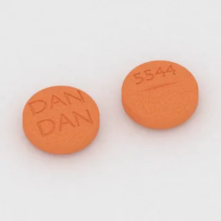 Allopurinol 300 mg tablet: orange, round, 11 mm, scored, imprinted DAN DAN 5544.
