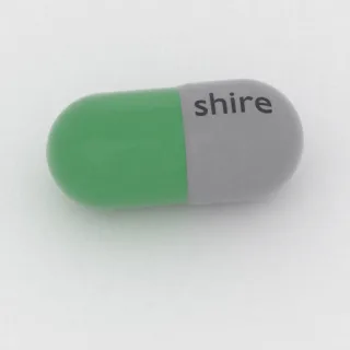 Karbamazepina 200 mg, kapsułka: szara i zielona, 20 mm, z oznaczeniem shire.