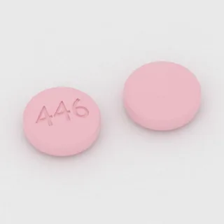 Bosentan 62.5 mg tablet: pink, round, 7 mm, imprinted 446.