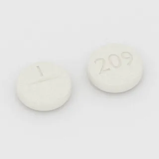 Allopurinol 100 mg tablet: white, round, 8 mm, scored, imprinted 1 on one side and 209 on the other.