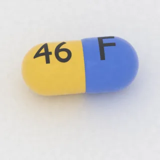 Atomoxetine 60 mg capsule: blue and yellow, 19 mm, imprinted F on one side and 46 on the other.