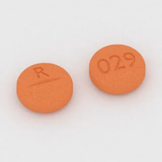 Alprazolam 0.5 mg tablet: orange, round, 7 mm, scored, imprinted R on one side and 029 on the other.