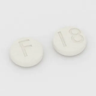 Kwas alendronowy 10 mg, tabletka: biała, okrągła, 5 mm, z oznaczeniem F po jednej stronie i 18 po drugiej.