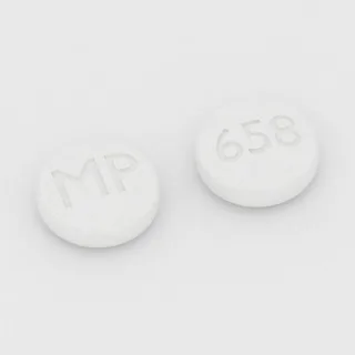 Clonidine 0.2 mg tablet: white, round, 7 mm, imprinted MP on one side and 658 on the other.