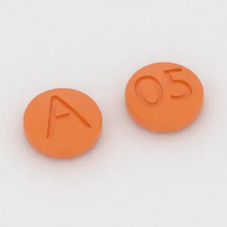 Citalopram 10 mg Tablette: orange, rund, 5 mm, Prägung A auf der einen Seite und 05 auf der anderen.