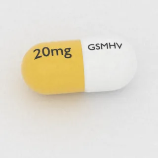 Carvedilol 20 mg capsule: white and yellow, 16 mm, imprinted GSMHV on one side and 20mg on the other.