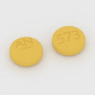 Betanecol 25 mg em comprimido: amarelo, redondo, 11 mm, sulcado, com a gravação AN de um lado e 573 do outro.