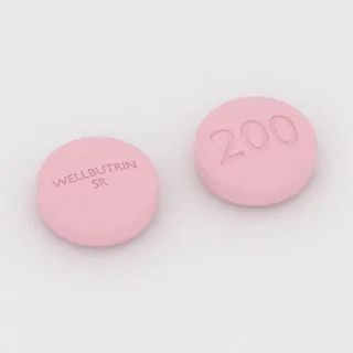 Bupropion 200 mg tablet: pembe, yuvarlak, 12 mm, üzerinde WELLBUTRIN SR 200 baskısı var.