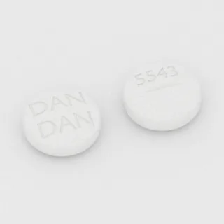 Allopurinol 100 mg tablet: white, round, 10 mm, scored, imprinted DAN DAN 5543.