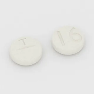 Benztropine 2 mg tablet: white, round, 7 mm, scored, imprinted T on one side and 16 on the other.