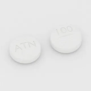 Atenolol 100 mg tablet: white, round, 10 mm, scored, imprinted ATN on one side and 100 on the other.
