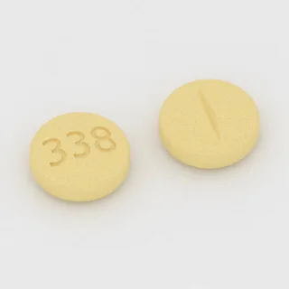 Benztropine 1 mg tablet: yellow, round, 6 mm, scored, imprinted 338.