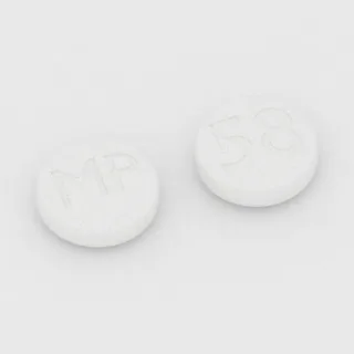 Karyzoprodol 350 mg, tabletka: biała, okrągła, 12 mm, z oznaczeniem MP po jednej stronie i 58 po drugiej.